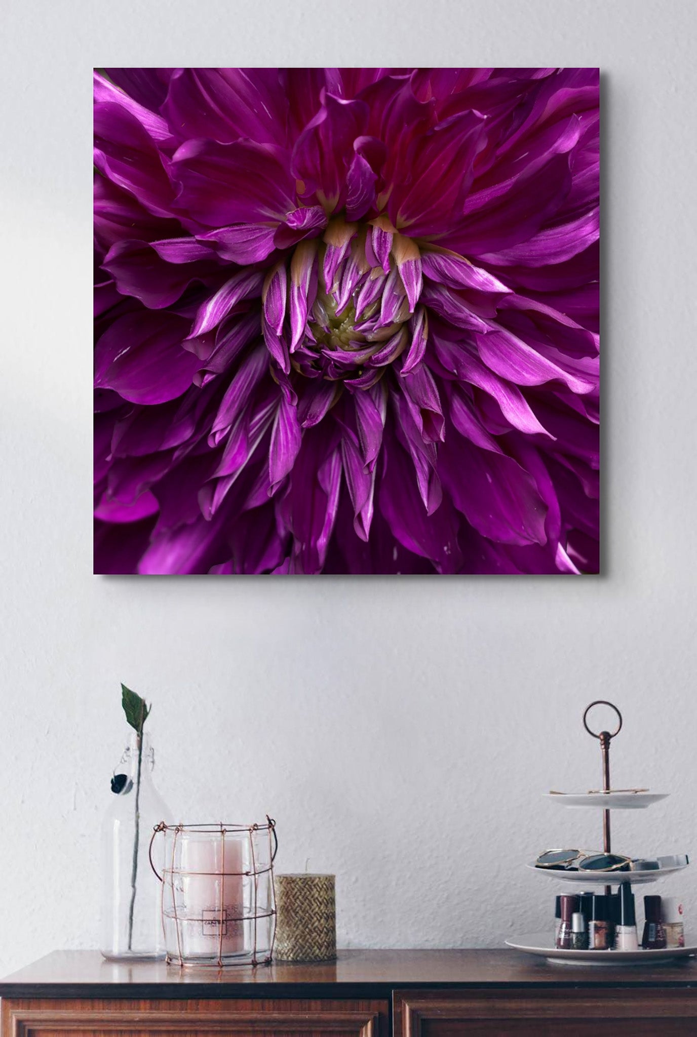 Picture hanging on the wall of a room. The picture is a fine art macro photograph of a purple Dahlia by Cameron Dreaux. 