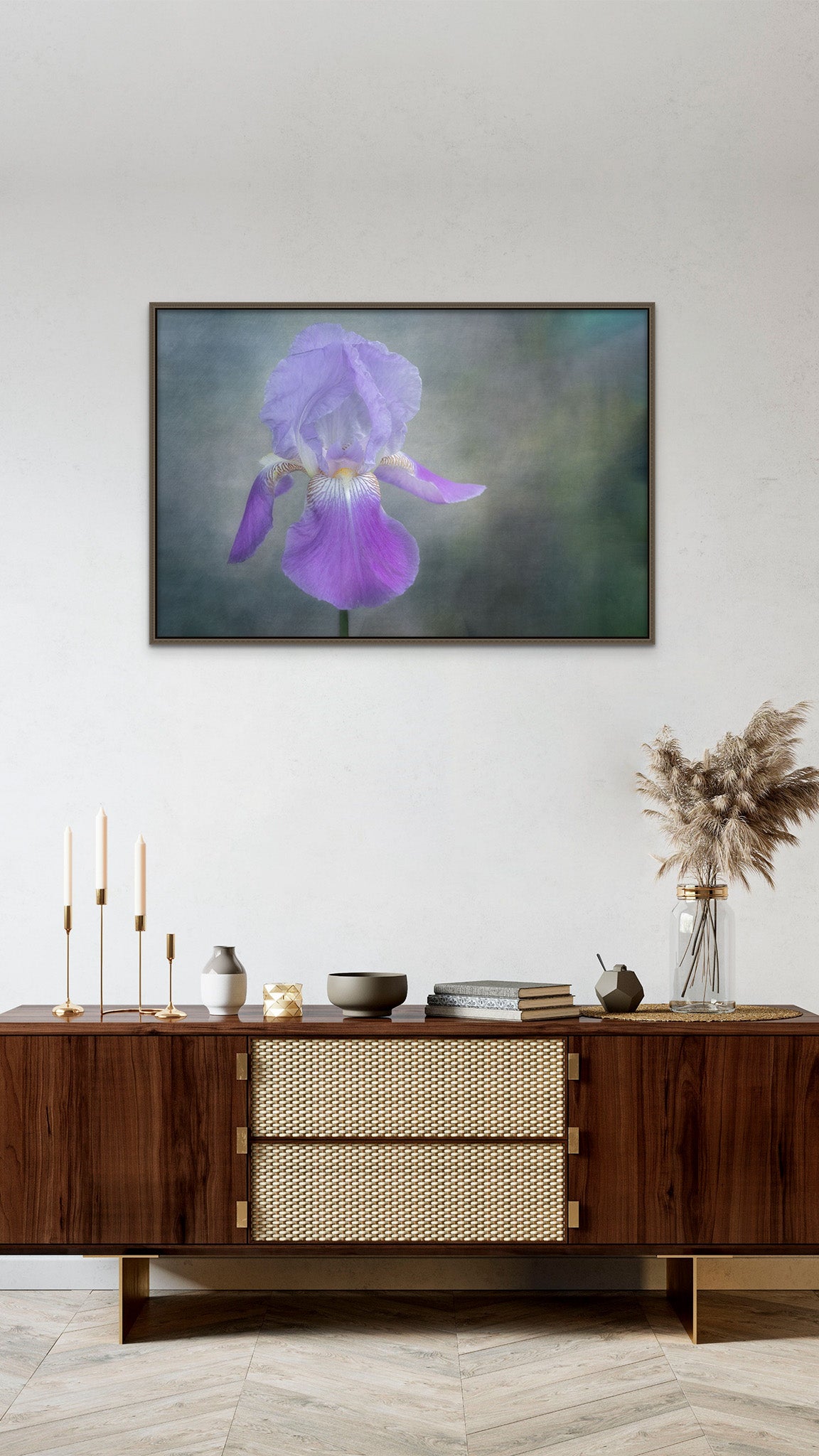 Picture hanging on the wall of a room. The picture is a fine art flower photograph of a purple Iris flower titled "Empowered" by Cameron Dreaux of Dreaux Fine Art.