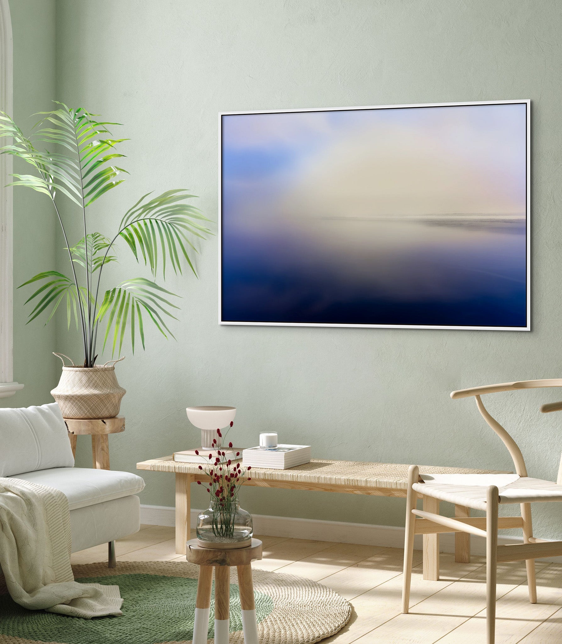 Picture hanging on the wall of a living room. The picture is a fine art landscape photograph titled "Go Toward the Light" by Cameron Dreaux of Dreaux Fine Art.