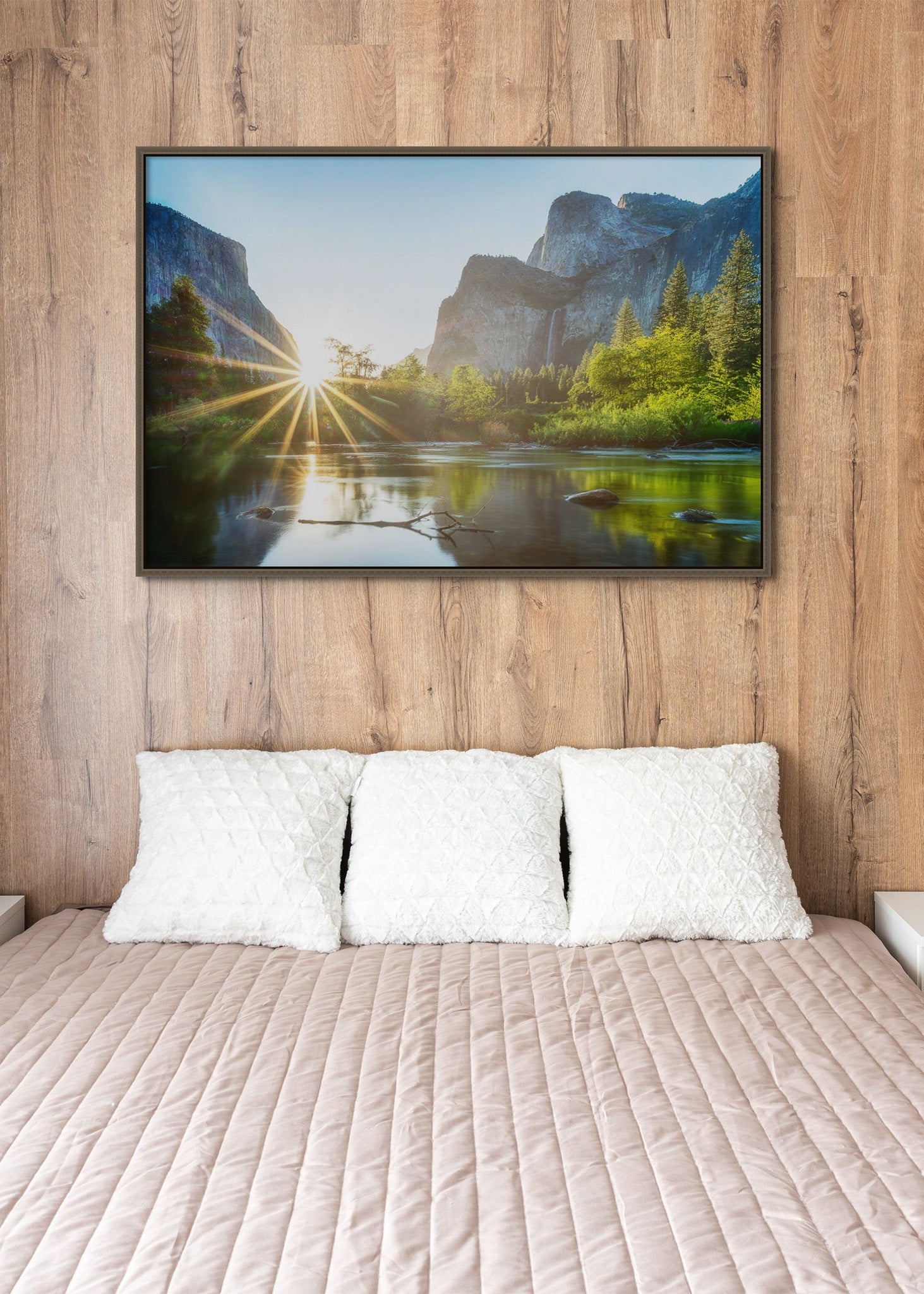 Picture hanging on the wall of a hotel room bed. The picture is a fine art landscape photograph titled "Summer Valley View" by Cameron Dreaux of Dreaux Fine Art.