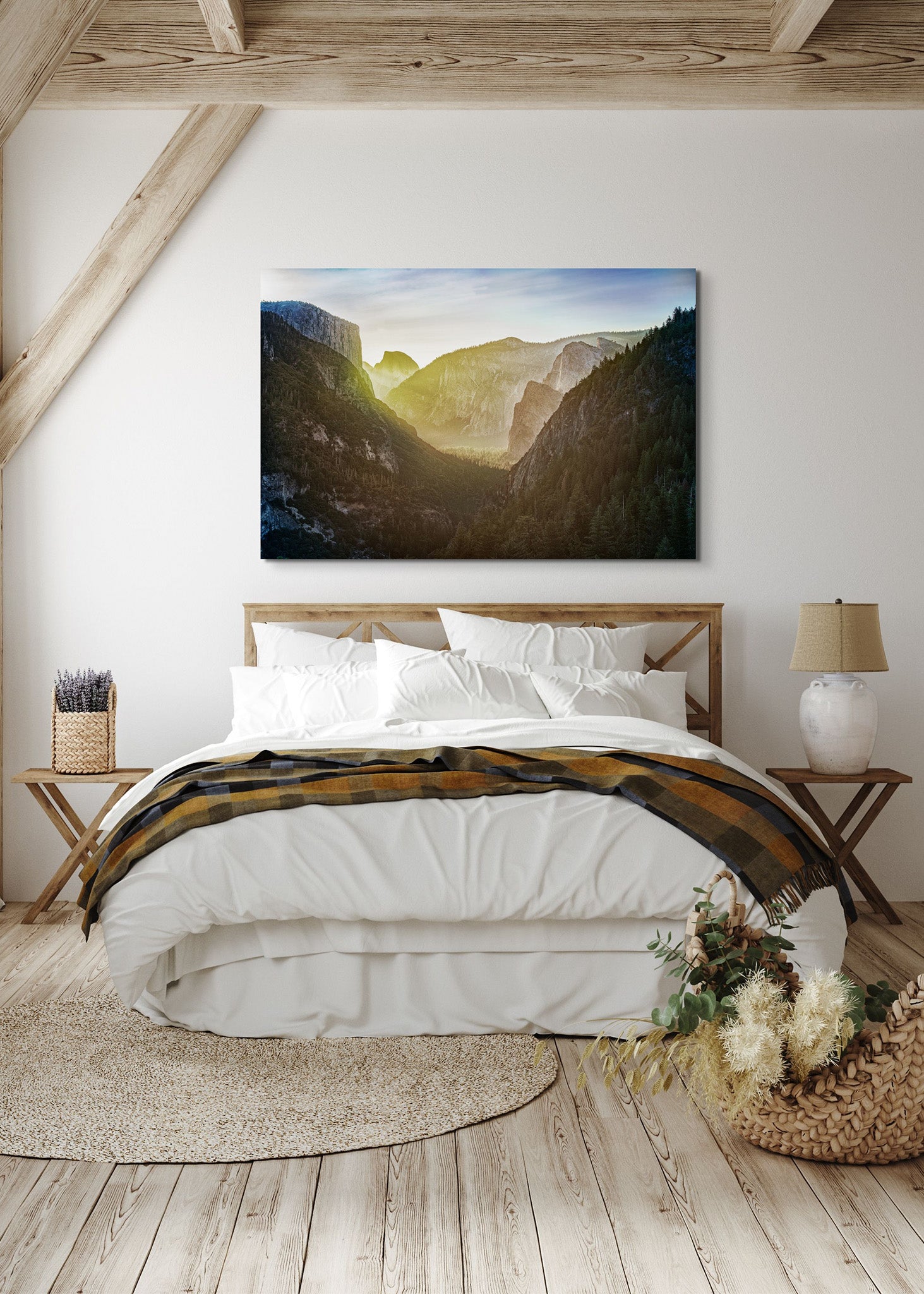 Picture hanging on the wall of a bedroom over the bed. The picture is a fine art landscape photograph titled "The Valley Awakens" by Cameron Dreaux of Dreaux Fine Art.