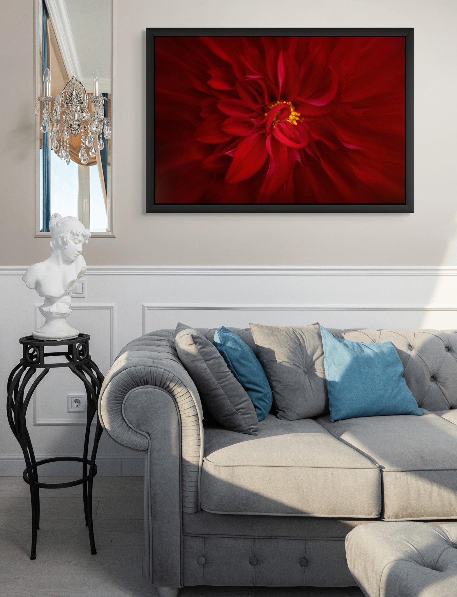 Art hanging on the wall of a living room. The art is photography by Cameron Dreaux titled Red Dahlia No. 1. The art is framed in a Black Wedge Float Frame. 